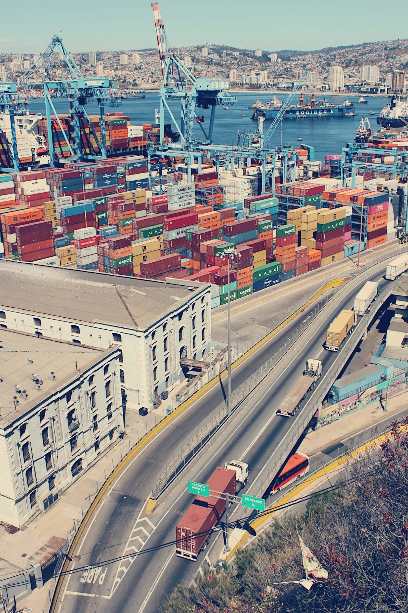 Container port with cranes loading cargo for export